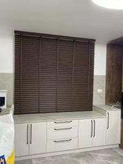 Walnut wooden Venetian blind made to measure in a kitchen