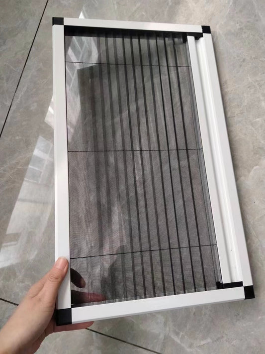 Pleated mosquito net with white aluminium frame, sample held in hand